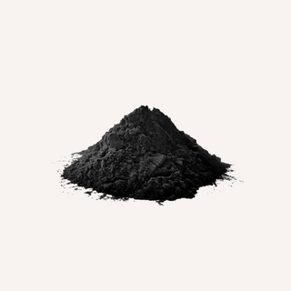 Activated charcoal powder, a fine black powder derived from various organic materials.