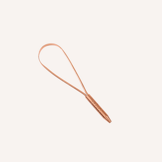 A luxurious Ayurvedic copper tongue scraper from Art of Vedas, designed to gently remove toxins and impurities from the tongue, promoting a healthier mouth and body.