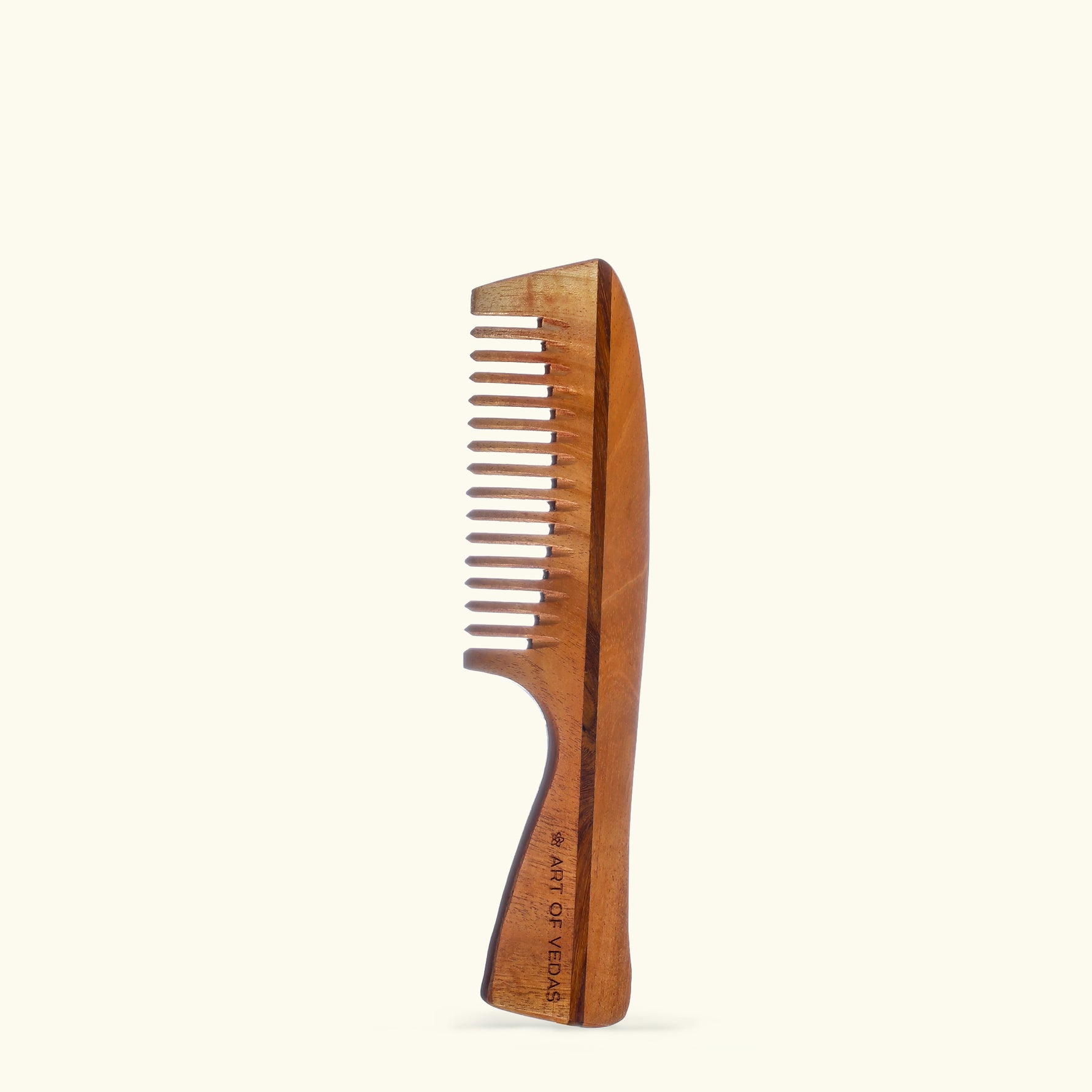 Indulge your hair in the nourishing benefits of Art of Vedas Neem Wood Comb, a natural comb infused with neem oil's anti-inflammatory properties that promotes hair growth, prevents dandruff, and leaves your hair feeling silky and smooth.